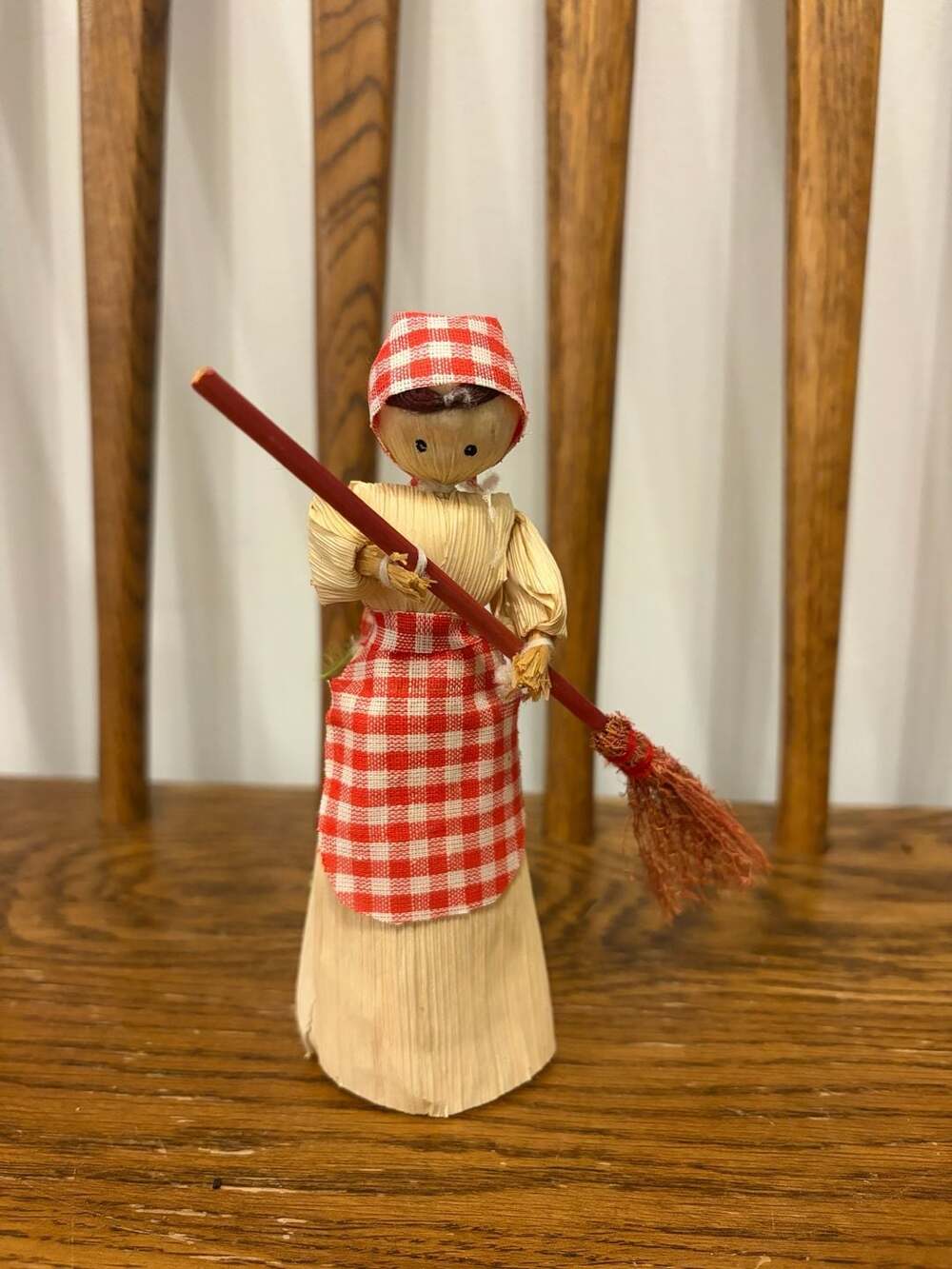 Vintage Handcrafted Corn Husk Doll with Red Gingham Apron and Broom